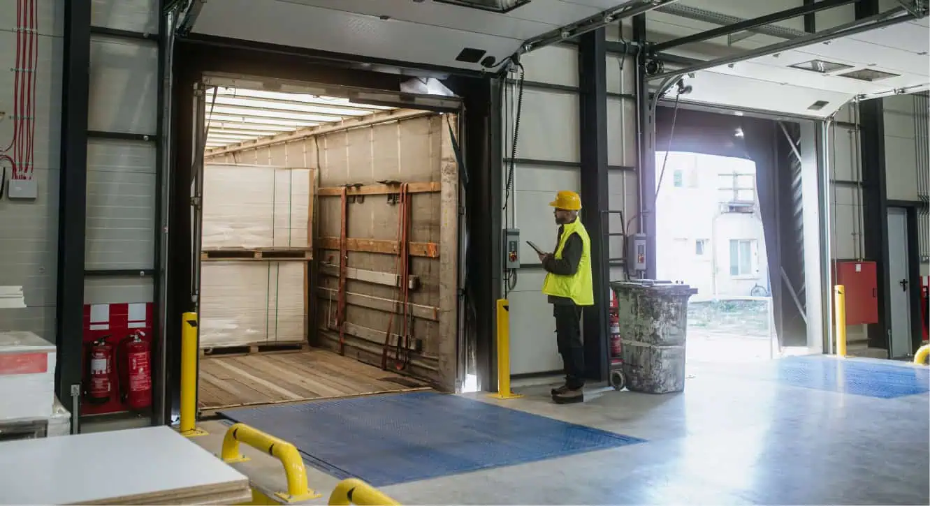 person loading cargo onto a freight truck