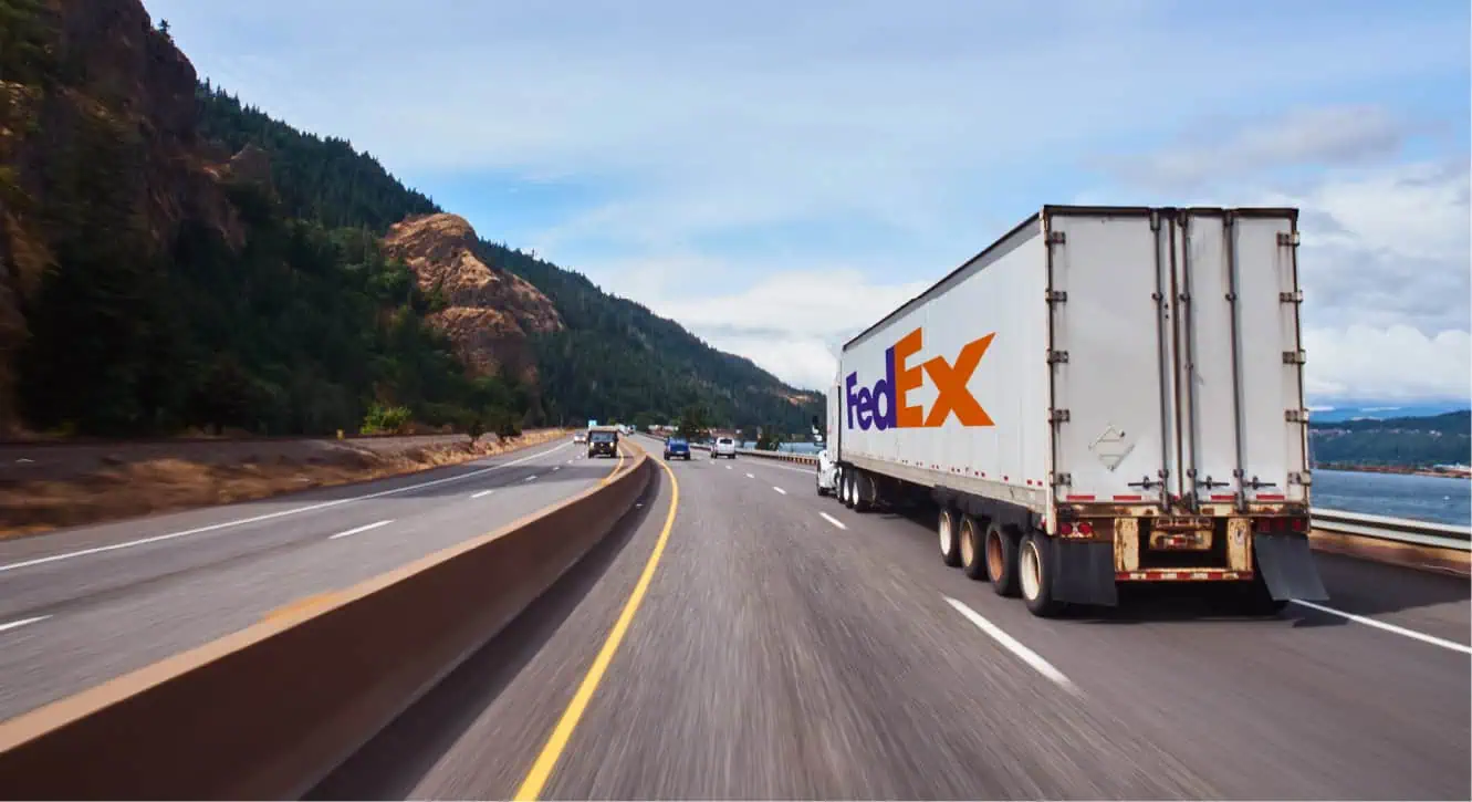 semi truck driving down a highway