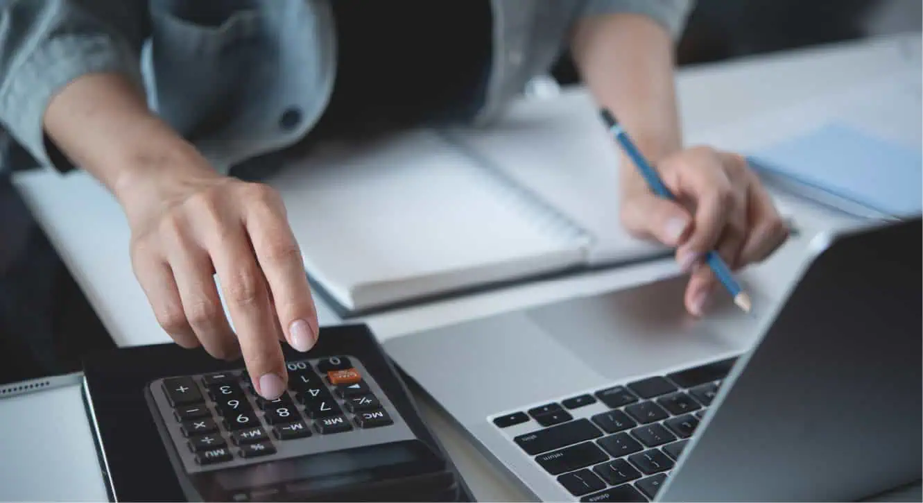 person at computer analyzing payment information