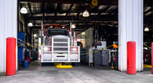 semi truck in a mechanic shop