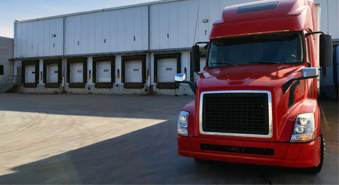 red truck at a warehouse