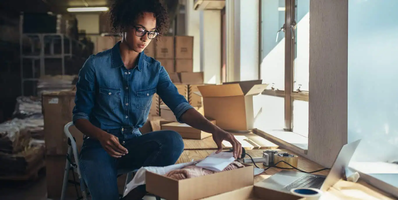 woman sending small parcel package blog featured image
