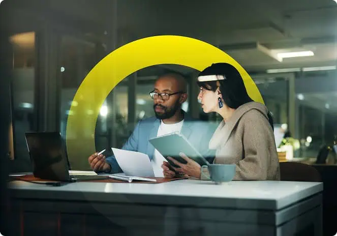 two people working at a desk together