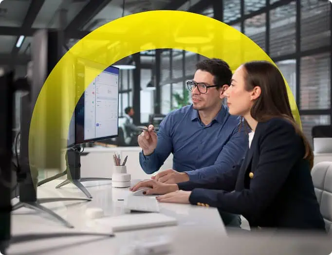 two people looking at computer showing analytics