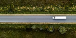 truck on wooded highway