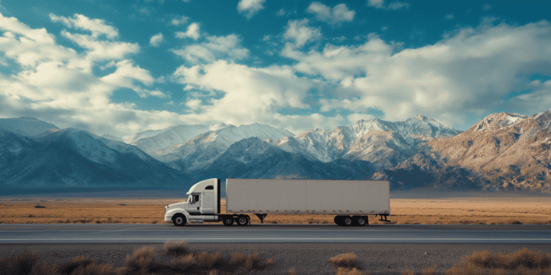 freight truck on highway near mountainous terrain